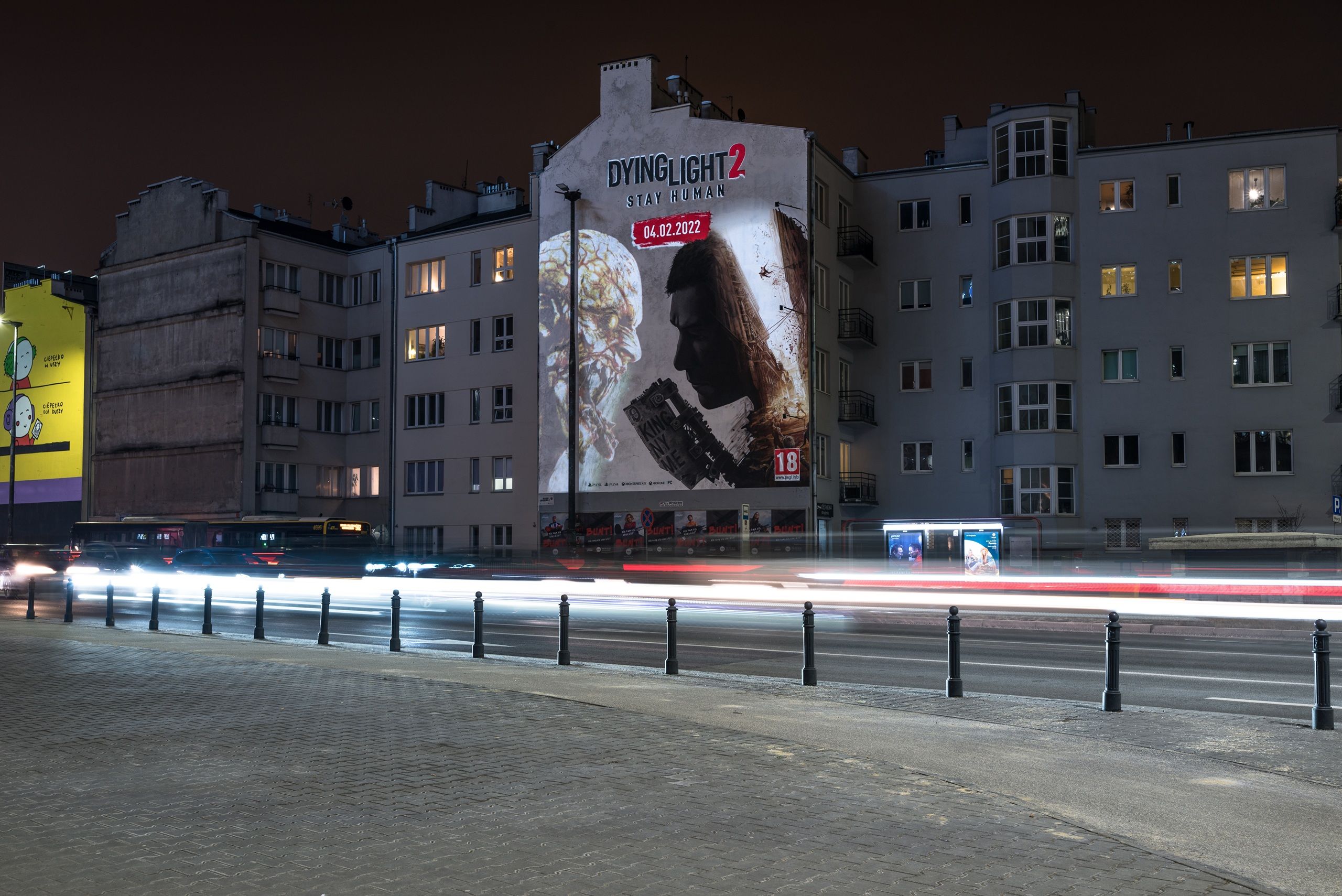 Mural promujący Dying Light 2 od Techland, namalowany przez Good Looking Studio, efekt w nocy